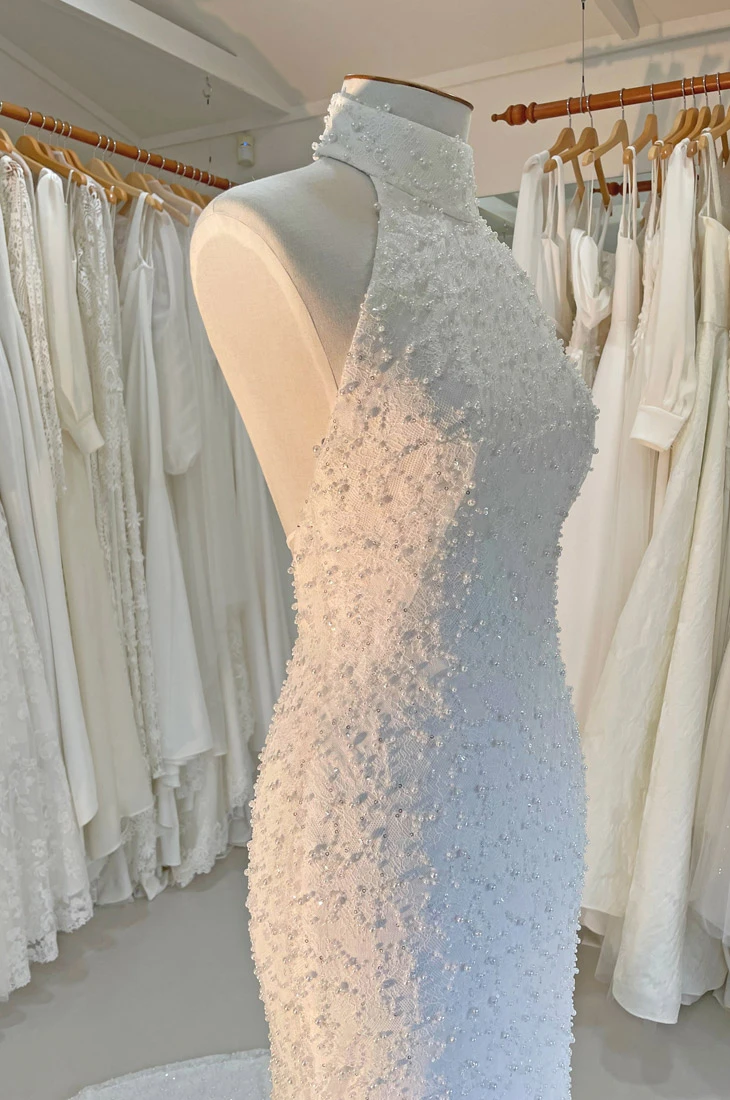 Pearl-beaded wedding dress with high neck and low back, Auckland, NZ.
