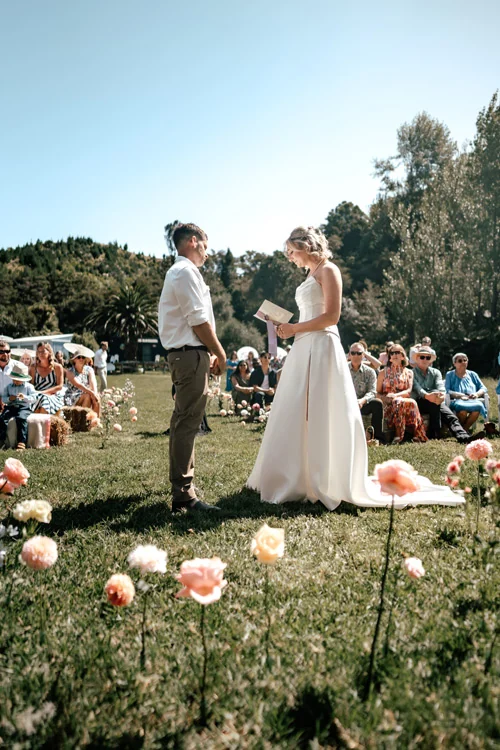 Convertible wedding dress with slender skirt and thigh-high slit, worn by real bride – Auckland, New Zealand.