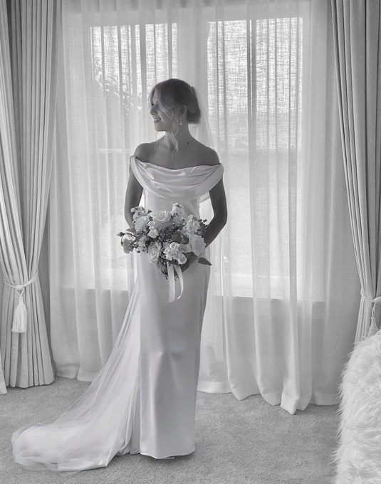 Real bride wearing a beautiful silk wedding dress.