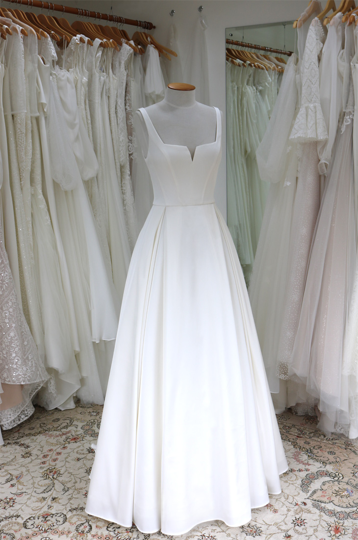 classic wedding dress, satin fabric, panelled bodice, square neckline, pleated A-line skirt