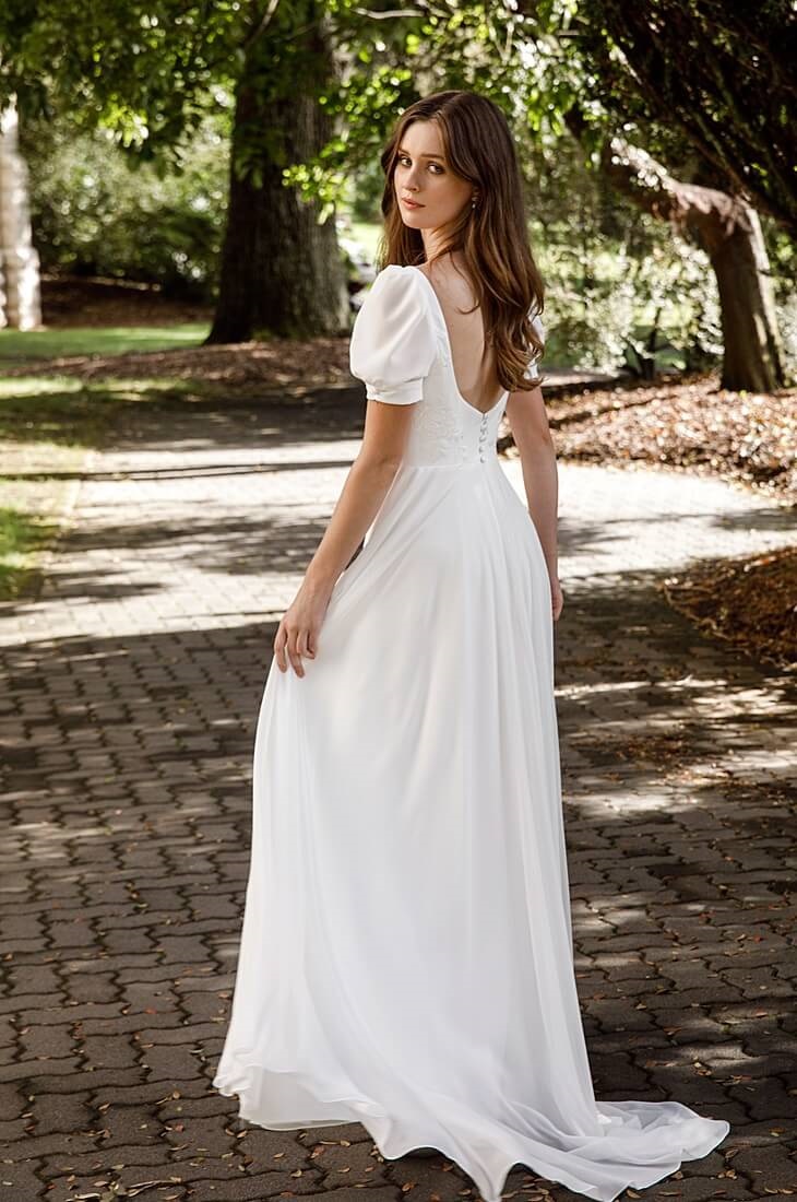 Simple chiffon wedding dress with delicate lace applique.