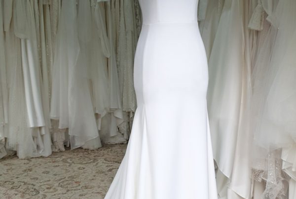 Simple fit and flare wedding dress with square neckline.