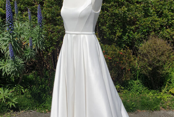 Classic taffeta wedding dress with A-line skirt.
