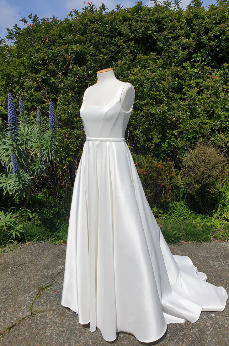 Classic taffeta wedding dress with A-line skirt.