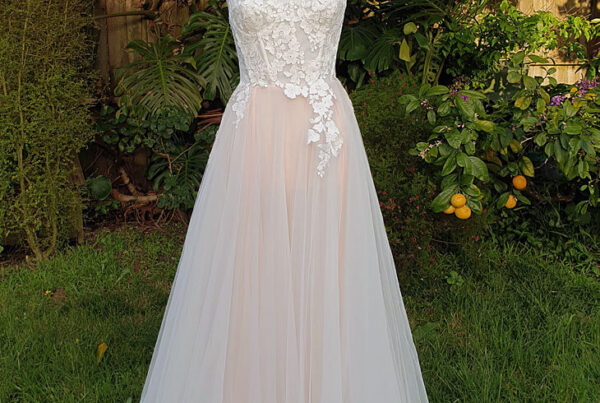 Corseted lace wedding dress with tulle skirt.