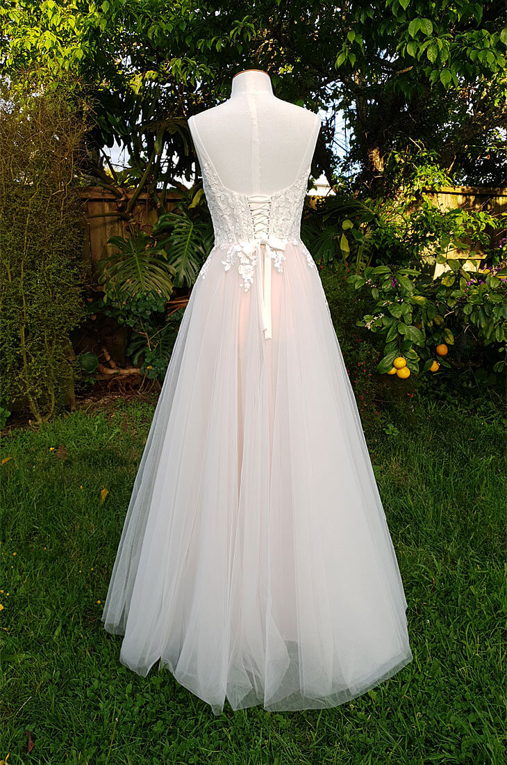 Lace up corset wedding dress with tulle skirt.