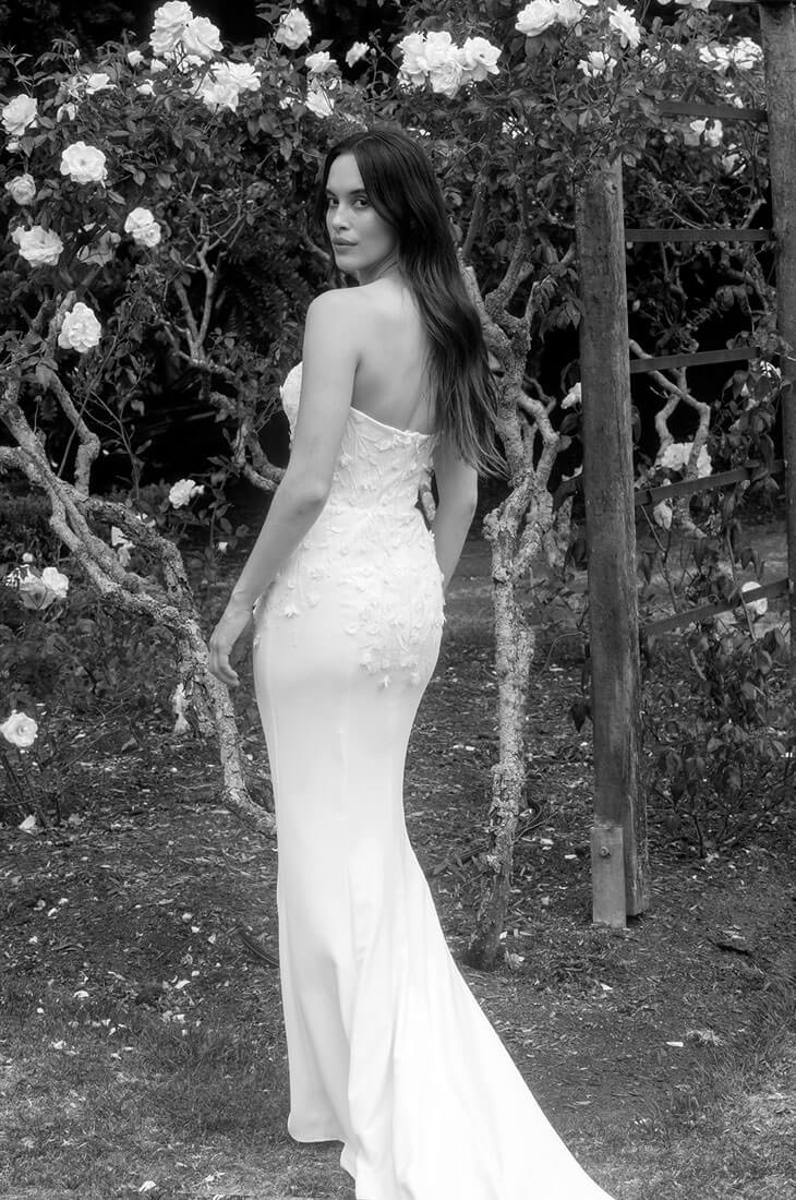 Fitted sheath wedding dress with lace detail.