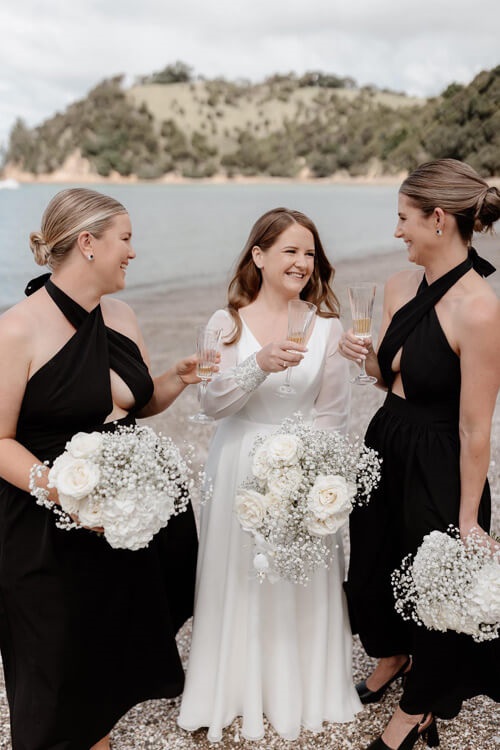 Real bride and her bridesmaids celebrating.