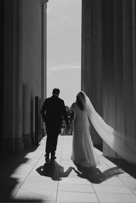 Bride and groom architectural shot at museum.