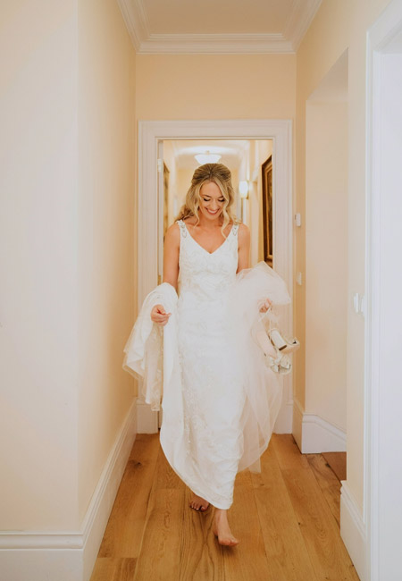 Real bride, walking without her shoes on.