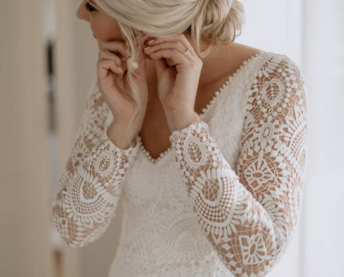 Real bride wearing a vintage lace wedding dress.