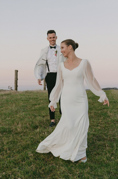 Bride and groom having fun, NZ countryside.