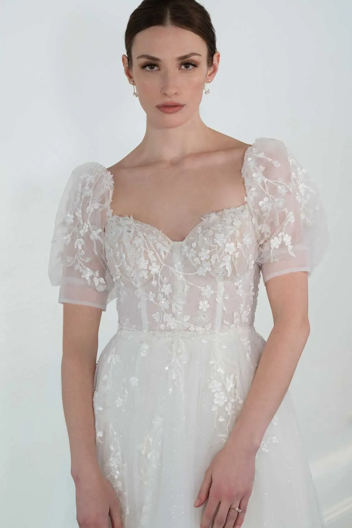 Lace wedding dress with puffy sleeves by Martina Liana.