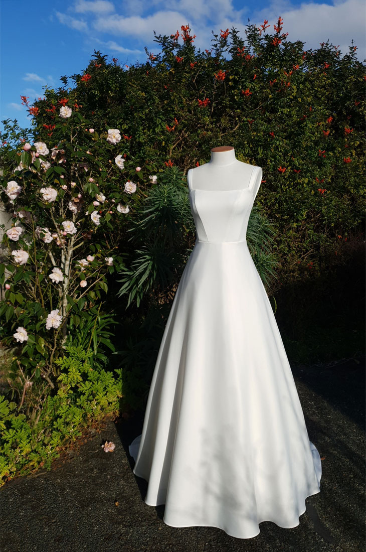 Classic A-line wedding dress in bridal satin.