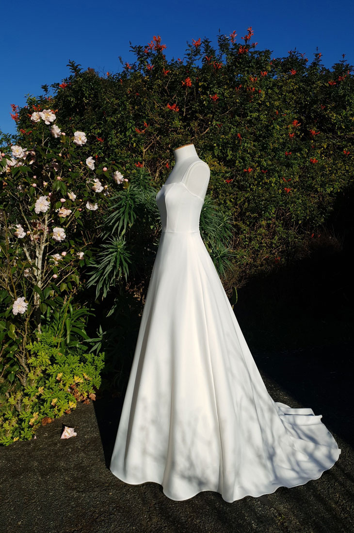 A-line wedding dress with square neckline and straps.