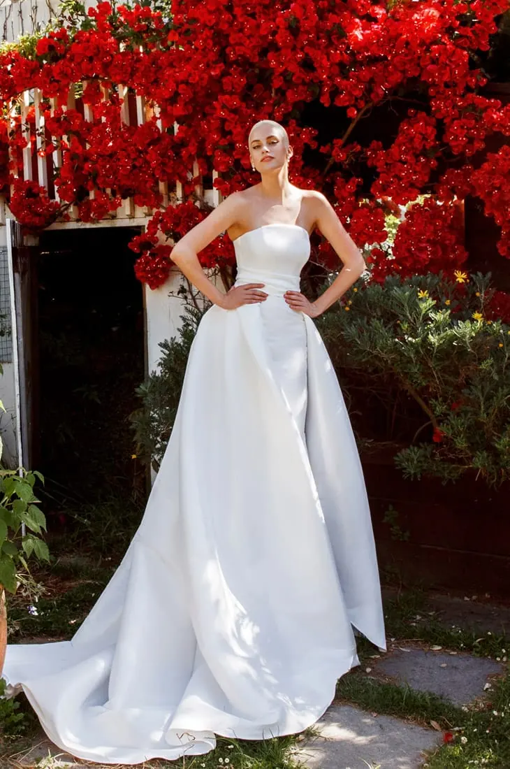 Strapless wedding dress with overskirt, by NZ designer Anna Schimmel, Auckland.