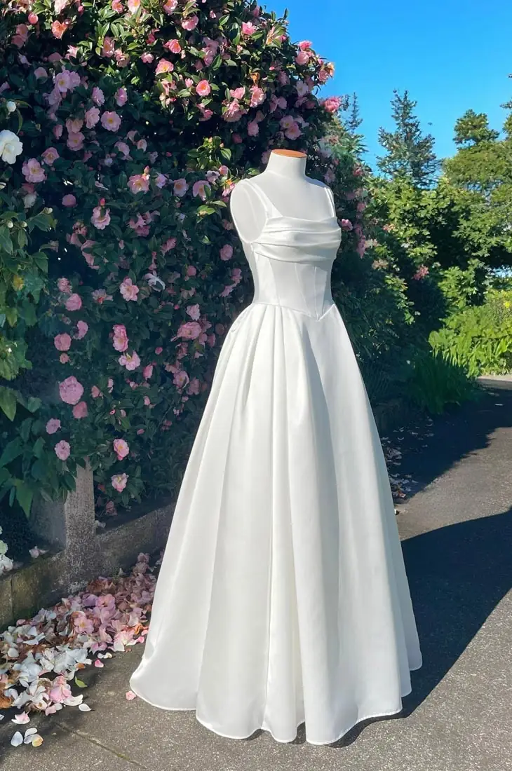 NZ designer wedding dress with basque waist and pleated full skirt, Auckland, New Zealand.