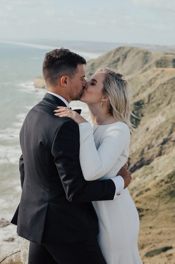 Crepe long sleeve wedding dress with a smooth silhouette and refined simplicity, designed in Auckland.