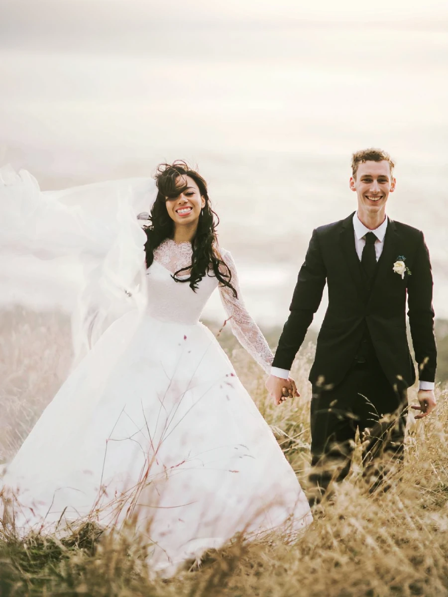 Classic lace long sleeve wedding dress with princess silhouette, by Anna Schimmel Bridal, Auckland, NZ.