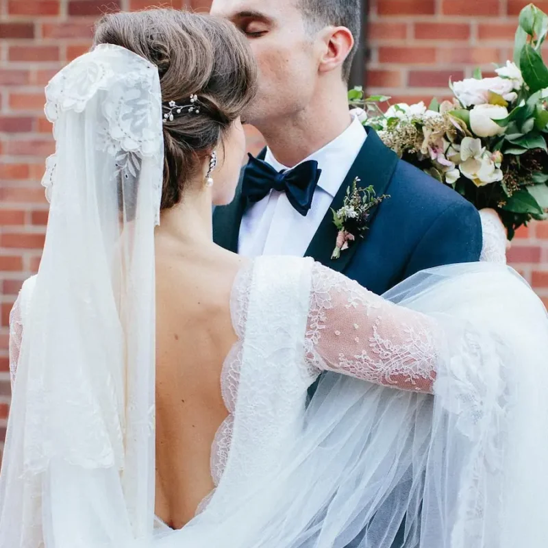 Romantic long sleeve wedding dress with low back, in fine French Chantilly lace, handmade in Auckland.