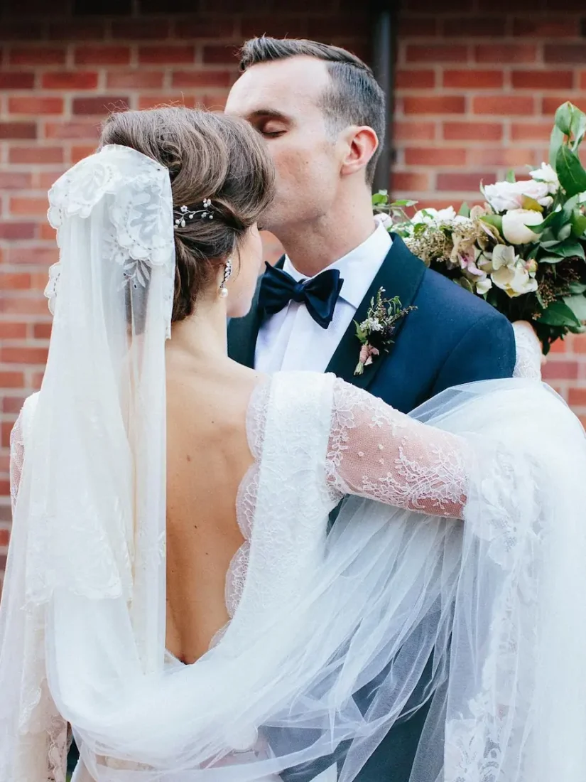 Romantic long sleeve wedding dress with low back, in fine French Chantilly lace, handmade in Auckland.