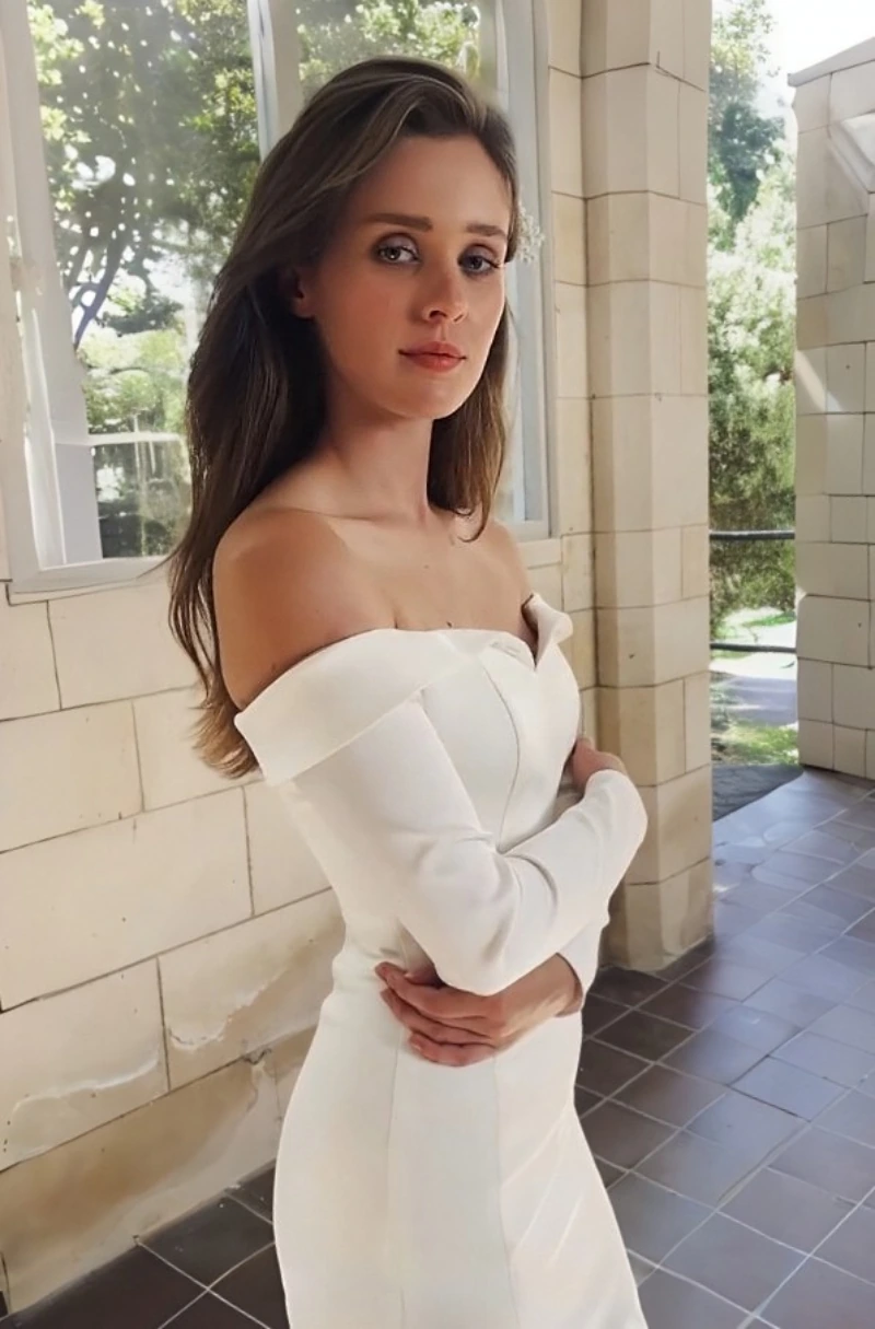 Glossy satin long sleeve wedding dress in a fitted style with long train, designed in Auckland.