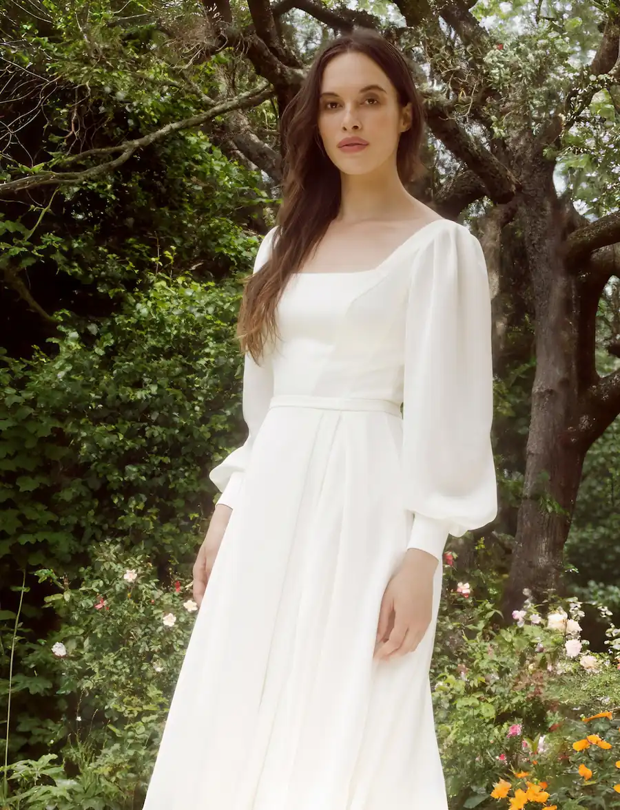 Simple long sleeve wedding dress with square neckline and A-line skirt, made in our Auckland bridal boutique.