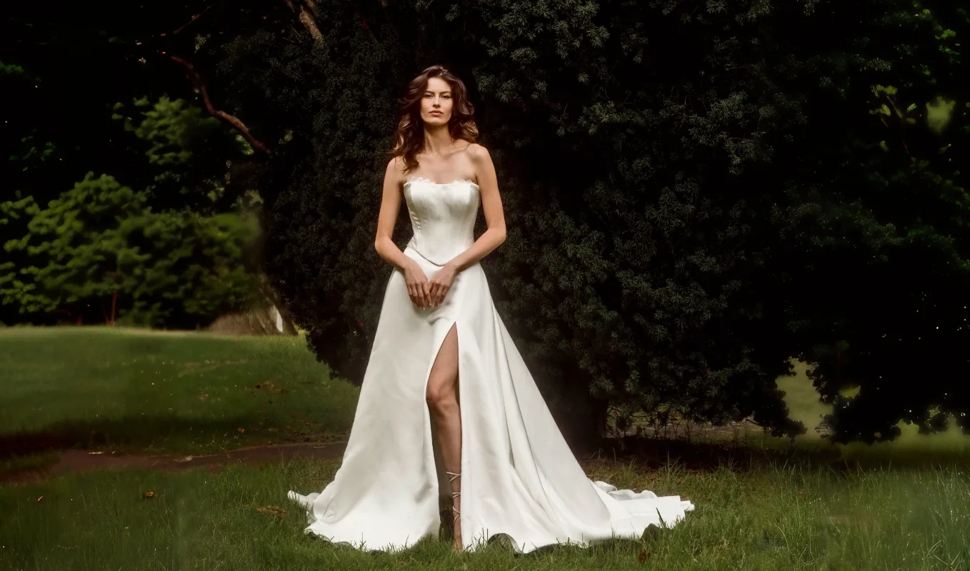 Strapless satin wedding dress with slit by Anna Schimmel in Auckland, New Zealand.