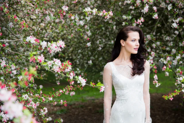 Fine Chantilly with sheer long sleeves.

This silk sheath wedding dress is made with silver French Chantilly lace, worn sheer through the decolletage and long sleeves. The fine lace pattern gives the bodice delicate surface detail, with the fitted sheath shape keeping the silhouette simple.

A quiet vintage feel, carried through fine fabric and precise detailing.

Each wedding dress purchased keeps a girl in Togo Africa in school for a year.

Wedding Dresses Auckland
Anna Schimmel

#AnnaSchimmel #AucklandWeddings #NZBridal #ChantillyLace #LaceWeddingDress #LongSleeveWeddingDress #SheathWeddingDress