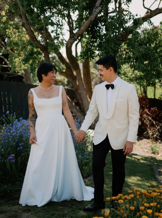 Pilar, in minimalist Mikado satin.

Pilar came to me with a clear vision: a beautifully simple wedding dress with a square neckline, wide straps and an A-line skirt.

We created a panelled, boned bodice, softening the square neckline for a flattering line across the décolletage. A full circle-cut skirt brings movement and volume to the silhouette, while the lustrous Mikado satin gives the dress its structure and presence.

A modern wedding dress defined by clean lines, beautiful proportions and luxurious fabric.

Each wedding dress purchased keeps a girl in Togo, Africa, in school for a year.

Wedding Dresses Auckland
Anna Schimmel

Photographer @claireriversphotography⁣⁣
Florist @florescencefloral⁣
Cake @ignatura.nz⁣
Catering @kisskisseatery⁣
Celebrant - Liz Ashworth⁣

#AnnaSchimmel #AucklandWeddings #NZBridal #MinimalistWeddingDress #MikadoWeddingDress