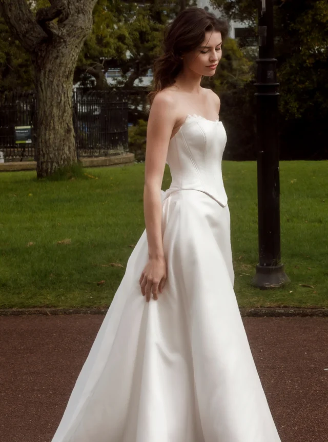 What is the best colour for your wedding dress?
Most wedding dresses sit somewhere between true white, off-white and ivory.
In my experience, true white, the colour of white paper, is quite stark and suits relatively few brides.
Off-white, sometimes called milk white, winter white, natural white or light ivory, is much softer. It tends to suit a wide range of skin tones, looks naturally white in daylight and works beautifully with most bridal fabrics. It is also the easiest shade to coordinate when combining satin, lace, tulle or chiffon in one dress.
Ivory has a warmer cream or golden undertone. It can be beautiful for vintage-inspired styling, warmer skin tones and brides who suit softer, richer colours.
Then there are more specialised options such as silver white, blush, champagne or nude linings. These can completely change the character of a wedding dress and are often used to bring out the texture of lace or create a more distinctive look.
The best bridal colour is rarely about choosing the whitest white. It is about finding the shade that works best with your design and makes your skin come alive.
#AnnaSchimmel #NZBride #NZWeddings #AucklandWeddings #WeddingDress #BridalStyle #IvoryWeddingDress