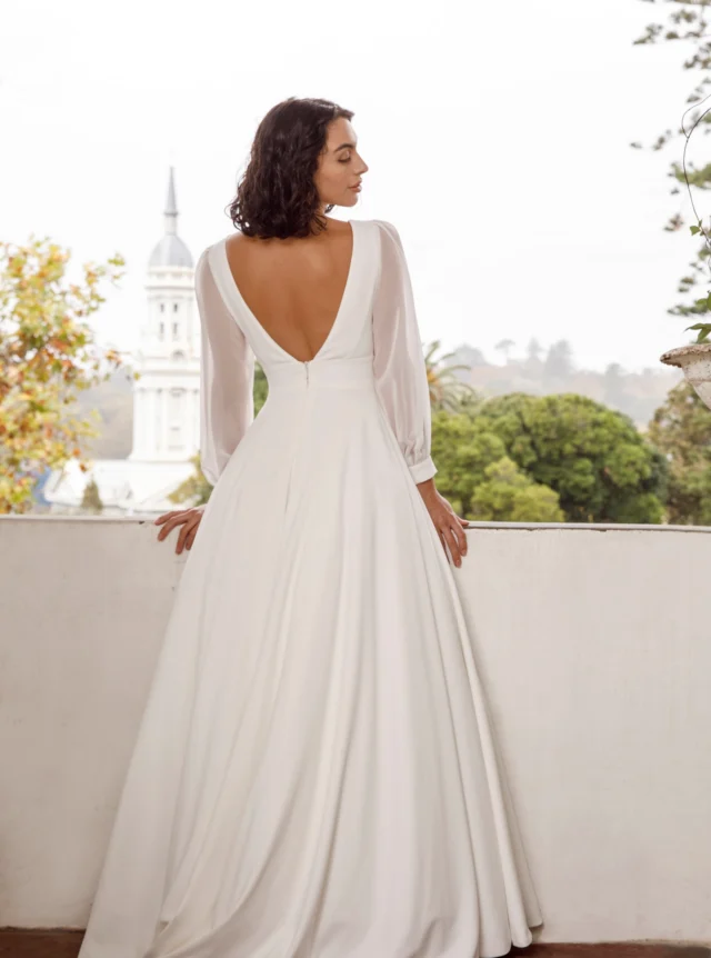 Should you choose an A-line wedding dress?

A classic of bridal fashion, the A-line skirt works with many different looks. It has a timeless quality and, through its volume and movement, often has more presence than a fitted gown.

Here are a few questions that may help you decide whether an A-line silhouette is right for you.

Are you curvy and would like to draw attention to your waist rather than your hips?

If your waist is smaller, a fitted bodice with an A-line skirt will highlight it beautifully while skimming over the areas where you feel fuller.

Do you love rustling full skirts or romantic layers?

The A-line silhouette is your friend. It gives you space for beautiful texture and allows your fabric to move and be noticed.

Are you planning to put some moves on the dance floor?

An A-line wedding dress gives your legs the space to move freely. Simply button up the train when it is time to dance.

Have you wondered whether you will feel comfortable posing for photographs?

A well-cut A-line looks beautiful from almost every angle. The fabric falls naturally and moves as you walk, turn and pose, making it a wonderfully photogenic shape.

Not sure about the volume?

An A-line wedding dress can be slender and restrained or wide and dramatic. The fabric and cut determine its shape, so you can choose the amount of fullness that feels right for you.

These wedding dresses from my collection show how varied an A-line silhouette can be.

Whatever you choose, you'll feel beautiful in your wedding dress. An A-line can give you that wonderful sense of occasion while still allowing you to move and enjoy the day.

#AnnaSchimmel #NZBride #NZWeddings #AucklandWeddings #ALineWeddingDress #DesignerWeddingDress #BridalStyle