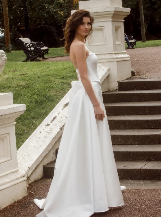 What makes a good strapless wedding dress?

A properly fitted, structured bodice is the secret. A strapless wedding dress should stay securely in place without you having to pull it up throughout the day.

The support needs to come from the construction of the bodice, not from how tightly the top is fitted. Internal boning, a well-shaped waist and the right fit all play an important part.

And the beauty of a strapless neckline? It leaves your shoulders and décolletage open, and works particularly well with a full A-line skirt.

Featured: Strapless wedding dress with a sculpted bodice, full A-line skirt and statement bow.

#AnnaSchimmel #NZBride #NZWeddings #AucklandWeddings #StraplessWeddingDress #ALineWeddingDress #BridalDesign